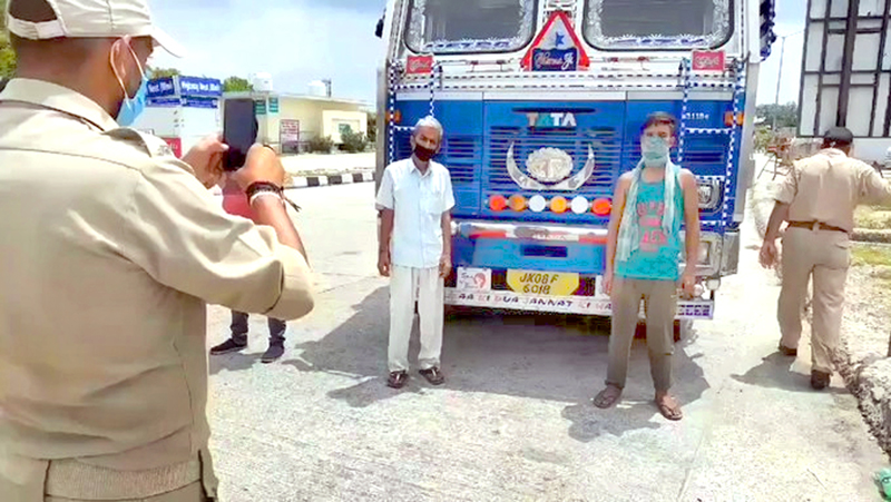 A truck undergoing security check at Lakhanpur on Sunday. -Excelsior/Madan A truck undergoing security check at Lakhanpur on Sunday. -Excelsior/Madan