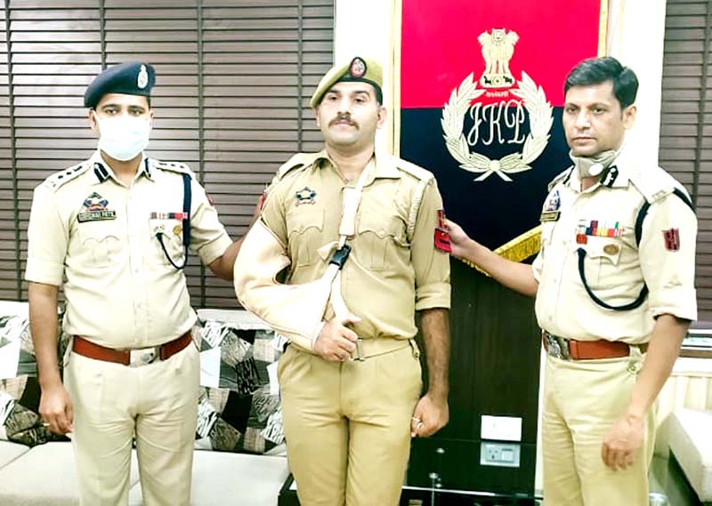 IGP Jammu Mukesh Singh along with SSP Jammu Shridhar Patil pinning new rank to a police official. IGP Jammu Mukesh Singh along with SSP Jammu Shridhar Patil pinning new rank to a police official.