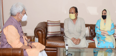 Lieutenant Governor Manoj Sinha meeting with family members of deceased Sarpanch, Ajay Pandita Bharti on Sunday. Lieutenant Governor Manoj Sinha meeting with family members of deceased Sarpanch, Ajay Pandita Bharti on Sunday.