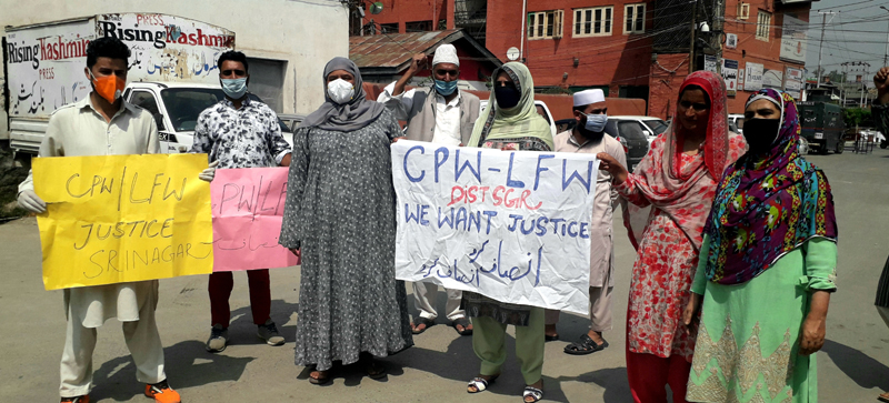 CPWs staging protest at Srinagar. — Excelsior/Shakeel CPWs staging protest at Srinagar. — Excelsior/Shakeel