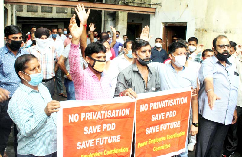 Power employees staging protest in Jammu on Tuesday. -Excelsior/Rakesh Power employees staging protest in Jammu on Tuesday. -Excelsior/Rakesh