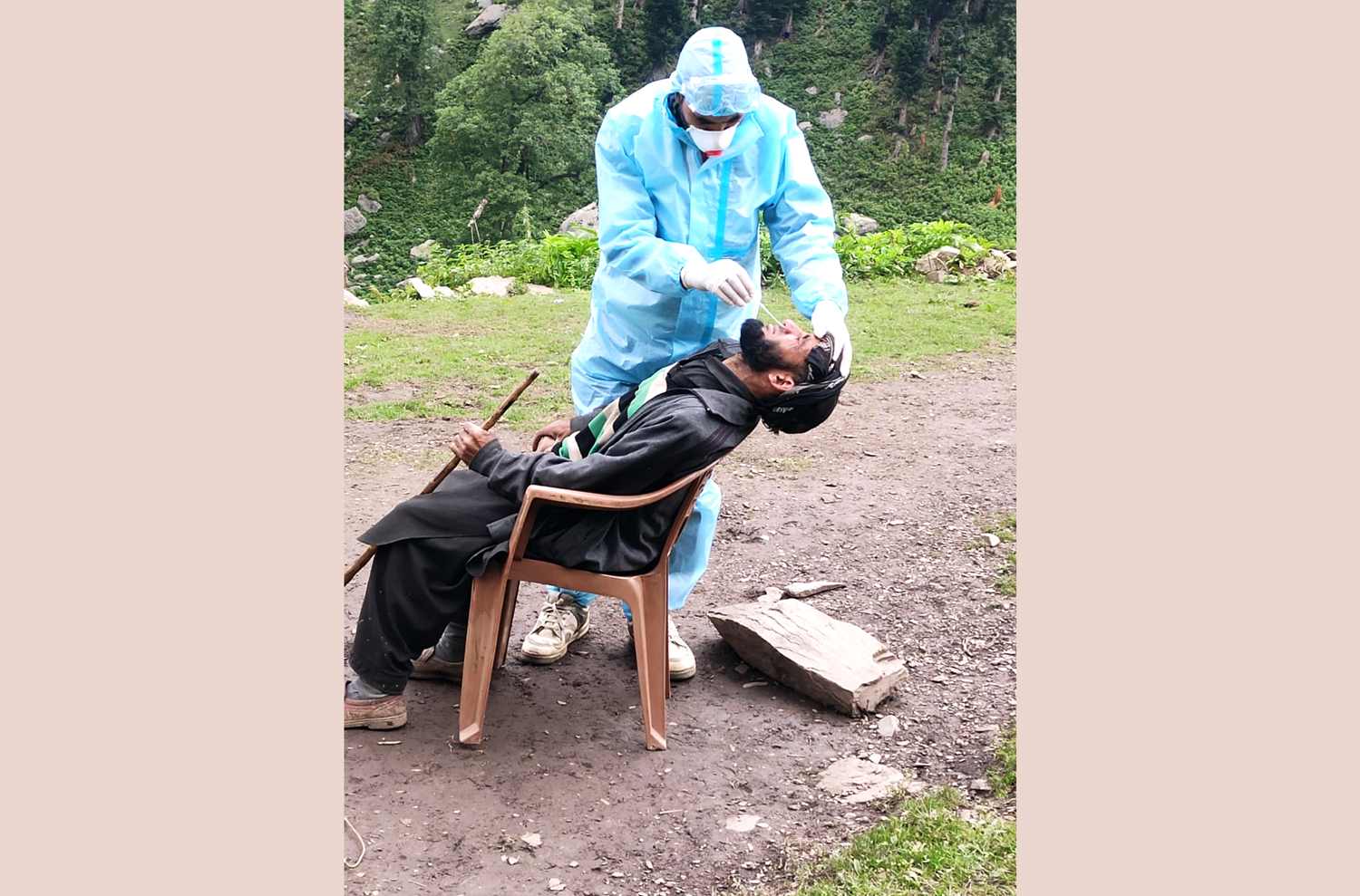 A Health worker tests a man for COVID-19 in Gulabgarh area of Reasi district on Sunday. -Excelsior/ Romesh Mengi A Health worker tests a man for COVID-19 in Gulabgarh area of Reasi district on Sunday. -Excelsior/ Romesh Mengi