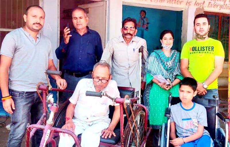 Office bearers of Beloved Grace Organisation presenting wheelchair and tricycle to needy persons. Office bearers of Beloved Grace Organisation presenting wheelchair and tricycle to needy persons.
