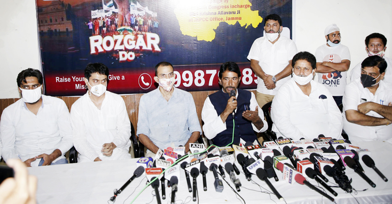 Congress leaders addressing press conference at Jammu on Friday.