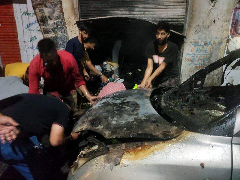 Shop and car damaged in fire followed by cylinder blast in Doda. —Excelsior/Rafi Choudhary Shop and car damaged in fire followed by cylinder blast in Doda. —Excelsior/Rafi Choudhary
