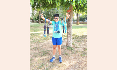Young marathon, Uday showing victory signs alongwith medals at Jammu. Young marathon, Uday showing victory signs alongwith medals at Jammu.
