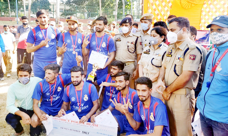 Winning team posing for a group photograph along with dignitaries at Reasi.