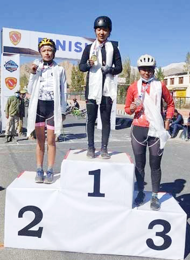 Women winners of Lakakh Cycle Race posing for a group photograph along with their medals at Leh. Women winners of Lakakh Cycle Race posing for a group photograph along with their medals at Leh.