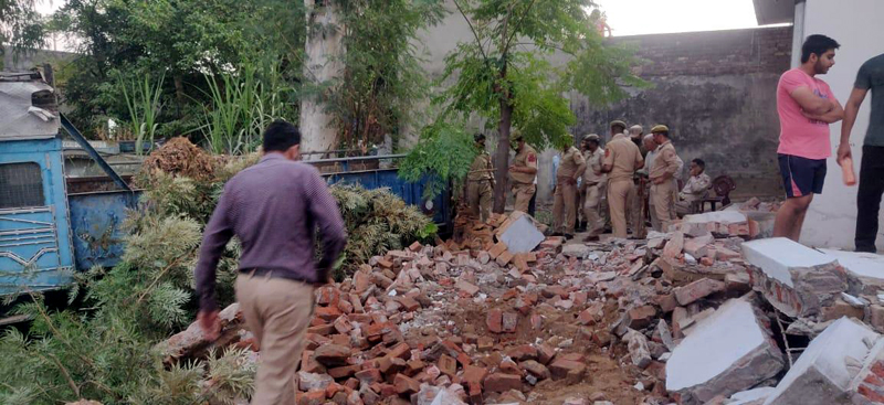 Illegal structures being demolished in Vijaypur on Saturday. -Excelsior/Badyal