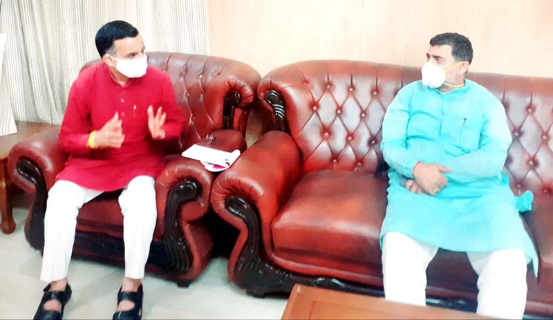 BJP leader Sanjay Kumar Baru in a meeting with MP Jugal Kishore Sharma.