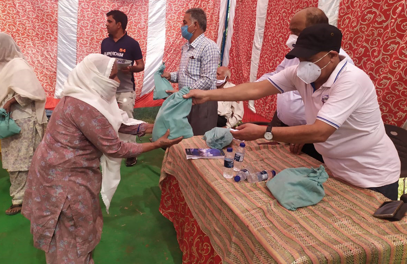 Members of We The Humans distributing COVID-19 hygiene kits.
