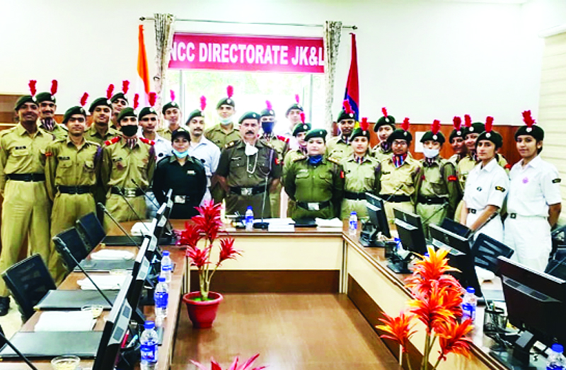 Major Dr Karan Singh along with cadets interacting virtually with Defence Minister, Rajnath Sigh from NCC Directorates Canal Road Jammu. Major Dr Karan Singh along with cadets interacting virtually with Defence Minister, Rajnath Sigh from NCC Directorates Canal Road Jammu.
