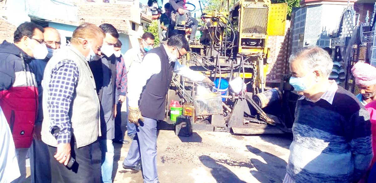 JMC Councillor, Sanjay Baru starting blacktopping work at Colonel Colony in Ward-41. JMC Councillor, Sanjay Baru starting blacktopping work at Colonel Colony in Ward-41.