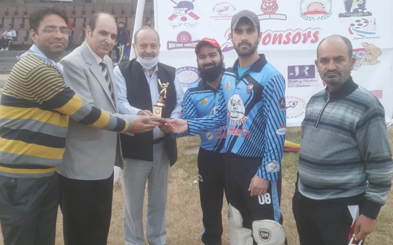 Dignitaries presenting trophy to a player during KPPL match at MA Stadium Jammu. Dignitaries presenting trophy to a player during KPPL match at MA Stadium Jammu.
