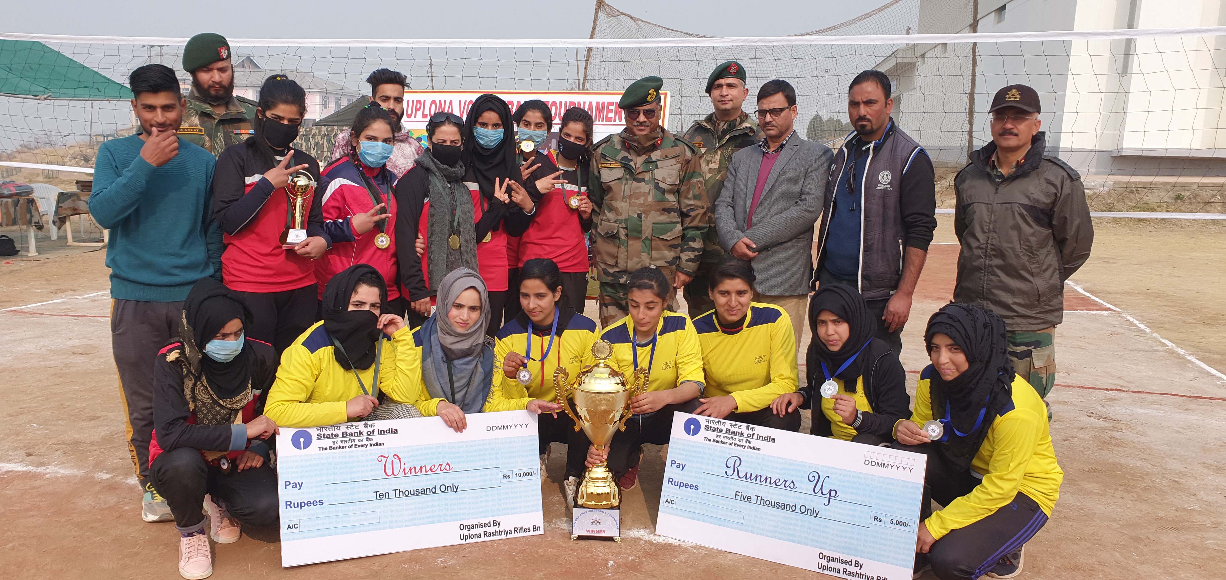 Winning players and dignitaries posing for a group photograph along with winning trophy at Baramulla. Winning players and dignitaries posing for a group photograph along with winning trophy at Baramulla.