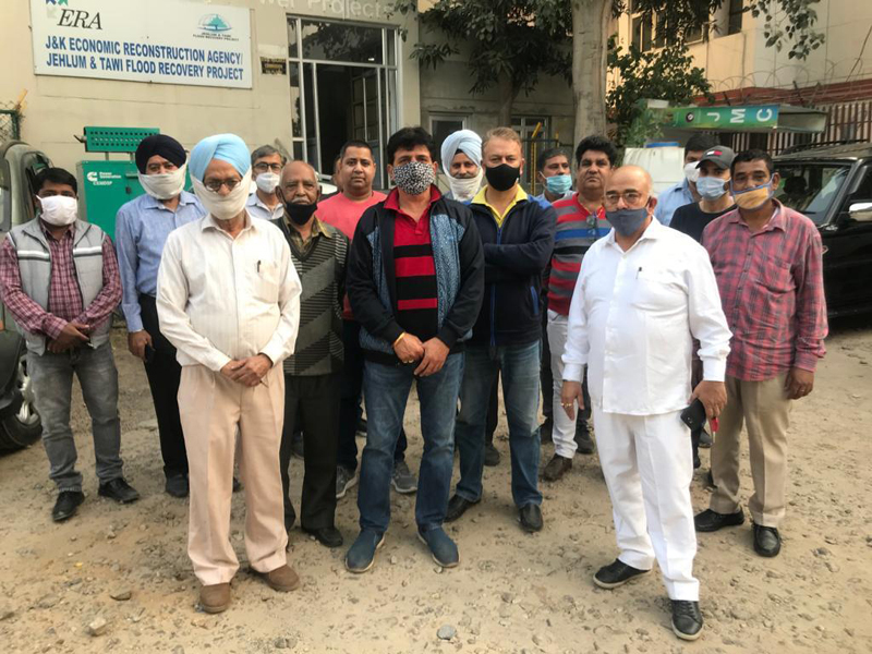 Piece workers, sub contractors and suppliers posing for photograph after discussing issues with MD JKPCC Limited. Piece workers, sub contractors and suppliers posing for photograph after discussing issues with MD JKPCC Limited.