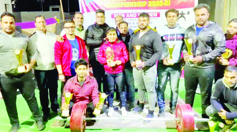 Winners posing for a group photograph along with their trophies at Jammu on Tuesday. Winners posing for a group photograph along with their trophies at Jammu on Tuesday.