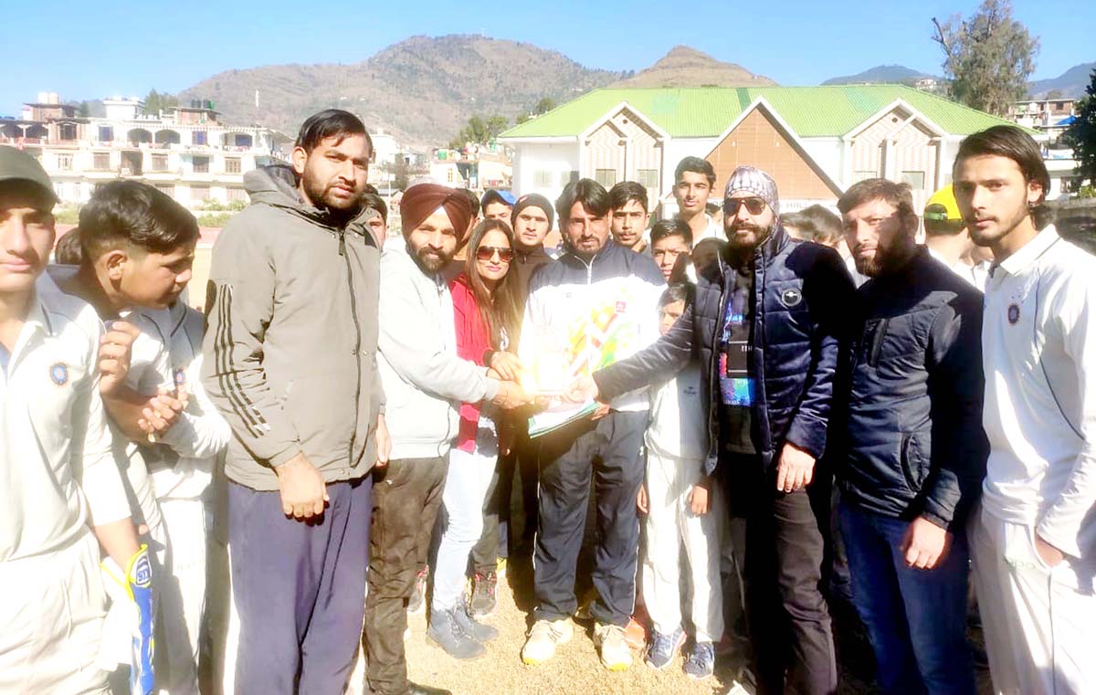Chief guest presenting memento to a player at Poonch.