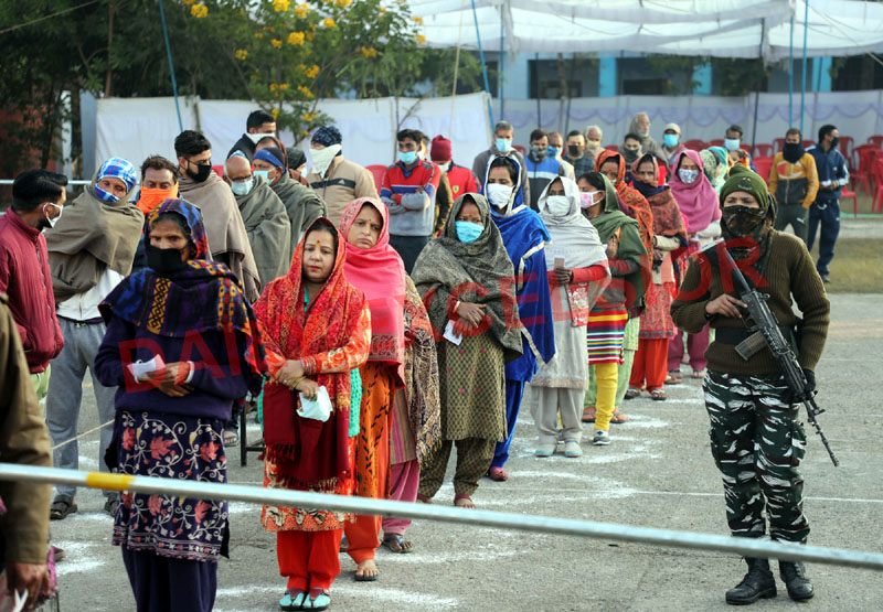 Voters standing in queues outside a polling station in Mandal block of Jammu district. —Excelsior/Rakesh Voters standing in queues outside a polling station in Mandal block of Jammu district. —Excelsior/Rakesh