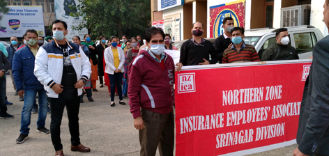 LIC employees staging protest in Jammu on Friday. LIC employees staging protest in Jammu on Friday.