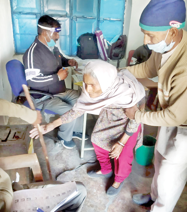 A 99 year old woman being supported by her relative while casting her vote at Polling Station Wassal in Billawar on Friday. -Excelsior/Pardeep A 99 year old woman being supported by her relative while casting her vote at Polling Station Wassal in Billawar on Friday. -Excelsior/Pardeep