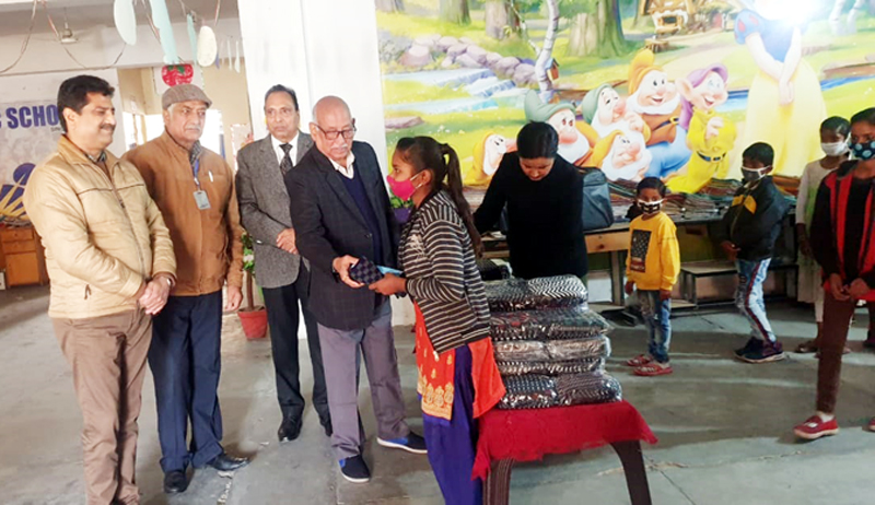 Trustee members distributing masks and caps among students at Channi Himmat. Trustee members distributing masks and caps among students at Channi Himmat.