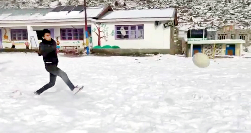 A player in action during Snow Football match at Latoo Kargil. -Excelsior/Basharat Ladakhi A player in action during Snow Football match at Latoo Kargil. -Excelsior/Basharat Ladakhi