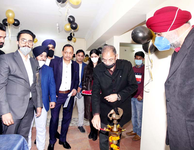 Excelsior Rakesh Ex-Deputy CM of J&K, Kavinder Gupta lighting ceremonial lamp at JKMA office in Channi Rama, Jammu. -Excelsior/Rakesh
