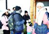 Lieutenant Governor Manoj Sinha interacting with tourists in Dal lake of Srinagar on Tuesday.