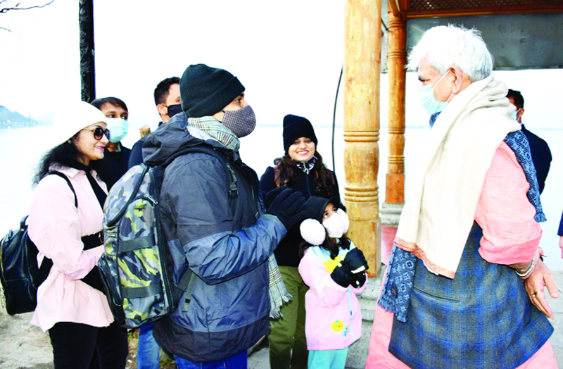 Lieutenant Governor Manoj Sinha interacting with tourists in Dal lake of Srinagar on Tuesday. Lieutenant Governor Manoj Sinha interacting with tourists in Dal lake of Srinagar on Tuesday.