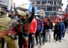 Security forces conduct searches of pedestrians in Lal Chowk area of Srinagar on Monday. —Excelsior/Shakeel