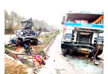 A van damaged beyond recognition after being hit by a Trailer near Mansar Morh in Samba on Saturday.