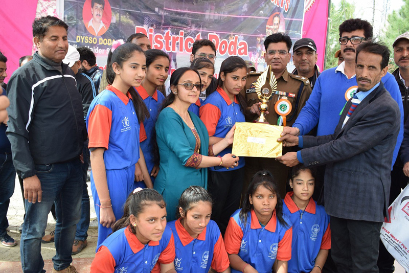ACP. Master Popsy presenting trophies and certificate to captain of winning team at Doda.