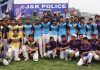 Winning team players posing for a group photograph with dignitaries at KC Sport Club Jammu.