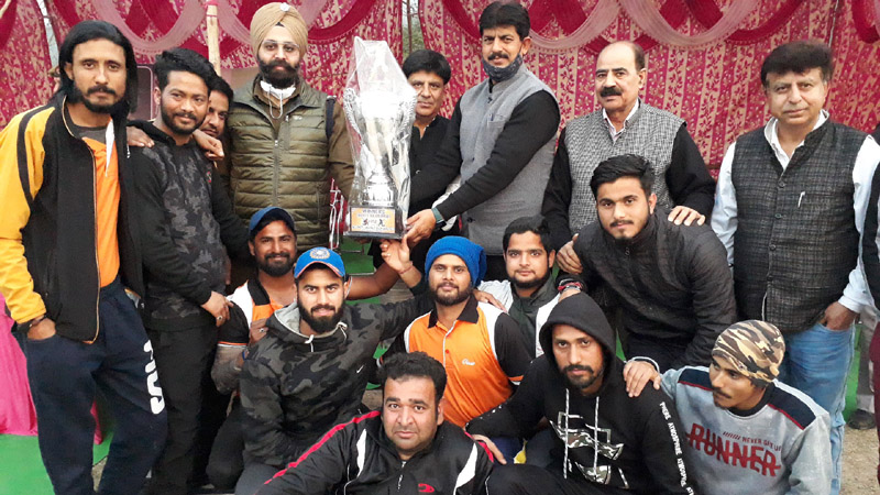 Winning team posing for a group photograph along with dignitaries and trophy at Jagti. Winning team posing for a group photograph along with dignitaries and trophy at Jagti.