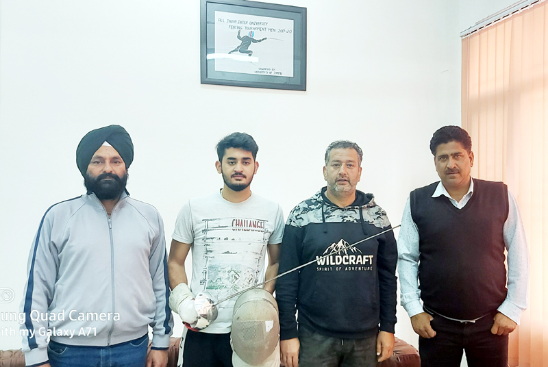 Udhayveer Singh Chandel posing for a group photograph with Director Sports JU, Dr Daud Iqbal Baba and others at Jammu. Udhayveer Singh Chandel posing for a group photograph with Director Sports JU, Dr Daud Iqbal Baba and others at Jammu.