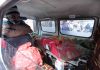 A kin of the deceased PHE daily wager along with his dead body in an ambulance. -Excelsior/Rakesh
