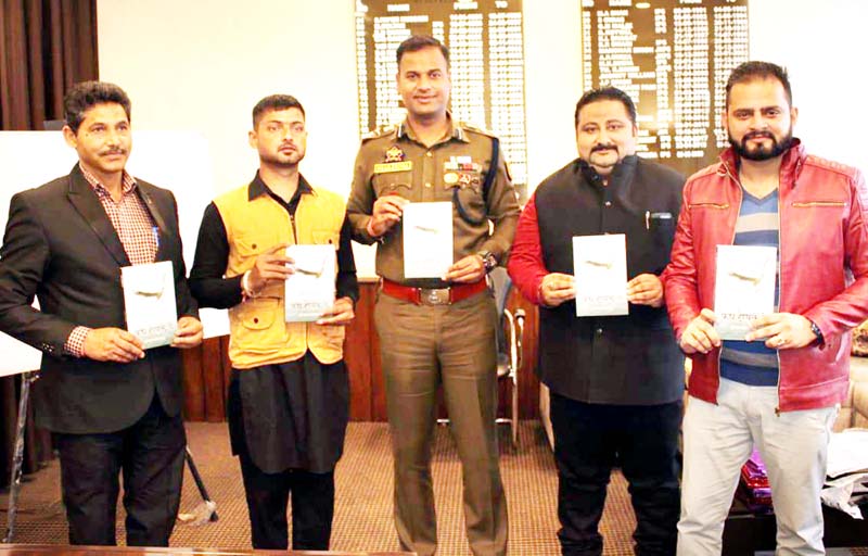 SSP Kathua, Dr Shailendra Mishra releasing a book at Kathua on Wednesday. -Excelsior/Pardeep SSP Kathua, Dr Shailendra Mishra releasing a book at Kathua on Wednesday. -Excelsior/Pardeep