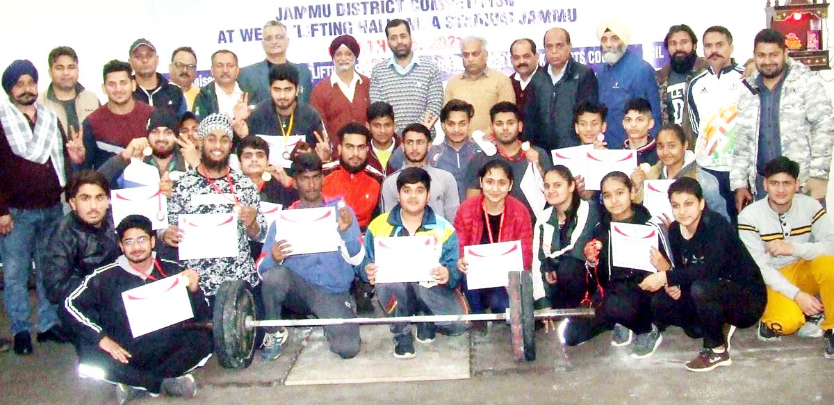 Medal winners of Weightlifting Championship posing for a group photograph with chief guest at Jammu on Friday. Medal winners of Weightlifting Championship posing for a group photograph with chief guest at Jammu on Friday.