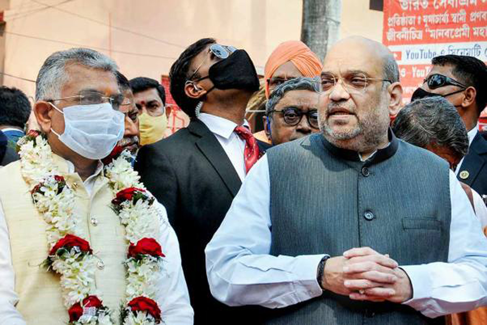 Union Home Minister Amit Shah interacts with media as West Bengal BJP State President Dilip Ghosh (L) looks on, after offering prayers at Bharat Sevashram Sangha, during his tw0-day visit to poll-bound West Bengal, in Kolkata. Union Home Minister Amit Shah interacts with media as West Bengal BJP State President Dilip Ghosh (L) looks on, after offering prayers at Bharat Sevashram Sangha, during his tw0-day visit to poll-bound West Bengal, in Kolkata.