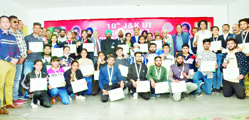 Winners of Shooting Championship posing for a group photograph along with dignitaries at Jammu. Winners of Shooting Championship posing for a group photograph along with dignitaries at Jammu.