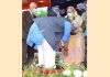 Lieutenant Governor Manoj Sinha touching feet of one of the family members of Brig Rajinder Singh at Samba on Friday.
