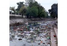 Ranbir canal-turned-garbage dump, awaits de-silting work. —Excelsior/Rakesh