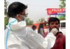 A Health worker subjects a man to COVID testing in Jammu on Monday.