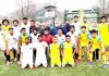 Wining team posing for group photograph with dignitaries after the match at Srinagar.