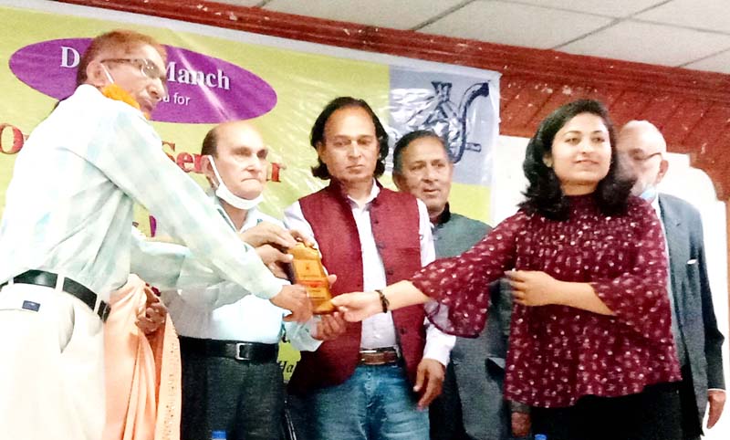 Dignitaries presenting awards to personalities working for the promotion of Dogri language. Dignitaries presenting awards to personalities working for the promotion of Dogri language.