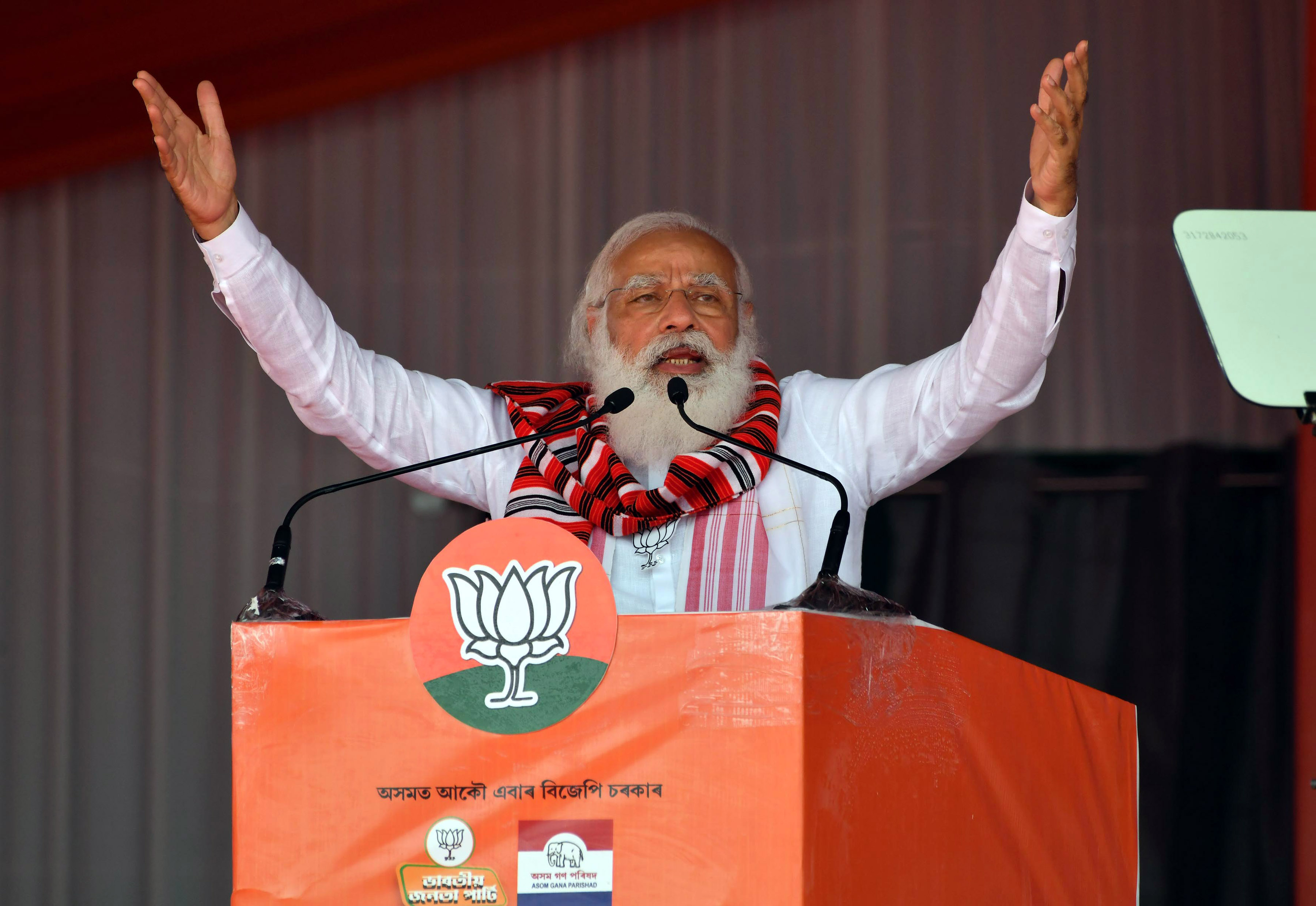 Prime Minister Narendra Modi addressing an election campaign rally for Assam Assembly polls at Bokakhat in Golaghat district on Sunday. (UNI) Prime Minister Narendra Modi addressing an election campaign rally for Assam Assembly polls at Bokakhat in Golaghat district on Sunday. (UNI)