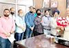 Wine traders delegation presenting bouquet to former Deputy Chief Minister Kavinder Gupta before submitting charter of demands.