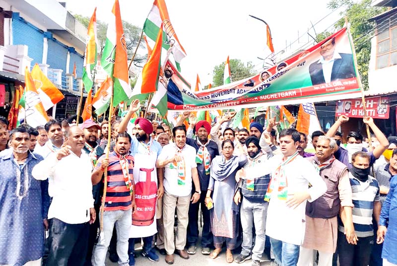 Cong activists taking out protest rally at R S Pura. Cong activists taking out protest rally at R S Pura.