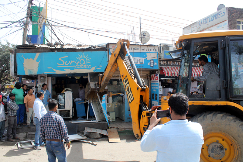 JCB demolishing illegal structures. —Excelsior/Rakesh JCB demolishing illegal structures. —Excelsior/Rakesh